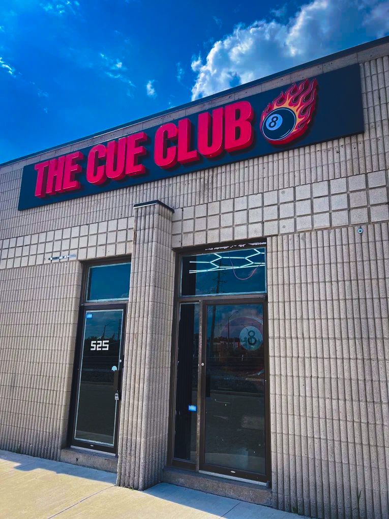 The Cue Club storefront sign